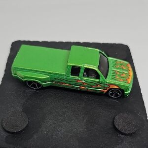 Vibrant Green Toy Truck with Flame Accents